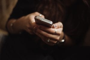 Woman using smartphone; image by Priscilla Du Preez, via unsplash.com.