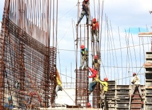 Construction workers working on a buliding; image by Josue Isai Ramos Figueroa, via Unsplash.com.