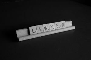 Scabble tiles in frame spelling out the word “lawyer”: image by Melinda Gimpel, via Unsplash.com.