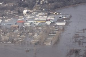 Aerial photo of an Air Force base and surrounding area swallowed by flooding.