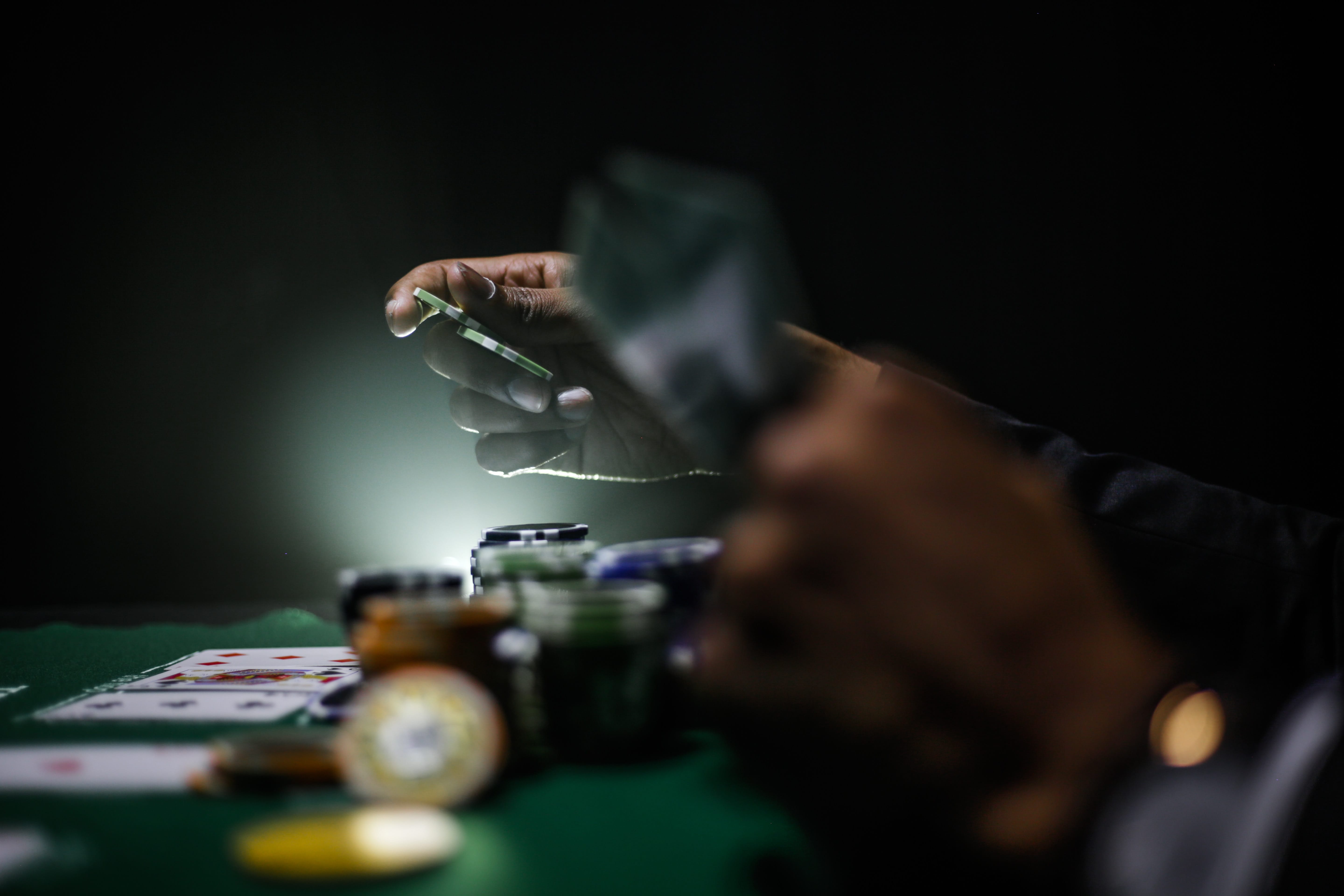 Selective focus photography of poker chips; image by Keenan Constance, via Unsplash.com.