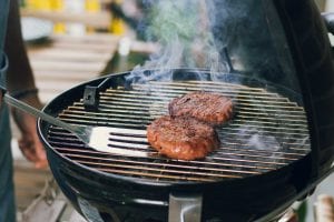 Burgers on the grill; image by Maude Frédérique Lavoie, via Unsplash.com.