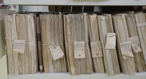 Large binders of files; image by Manu Schwenderer, via Unsplash.com.