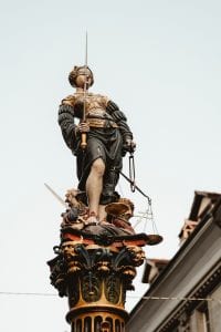 Statue of Lady Justice; image by Joel & Jasmin Førestbird, via Unsplash.com.