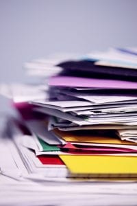 Pile of mail waiting to be sorted; image by Sharon McCutcheon, via Unsplash.com.