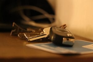 Selective focus shot of car keys sitting on table; image by LauraTara, via Pixabay.com.