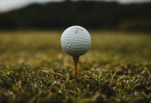 Golf ball on tee; image by Will Porada, via Unsplash.com.