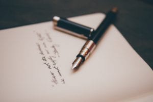 Black and silver fountain pen on paper; image by Álvaro Serrano, via Unsplash.com.