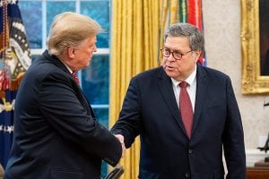 Two aging white men in suits, shaking hands.