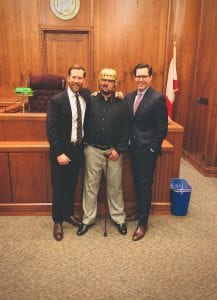 Client Zachary Lucas with Alexander Shunnarah Personal Injury Attorneys Brandon Bishop and Andrew Moak. Image courtesy of Shunnarah Personal Injury Attorneys, P.C.