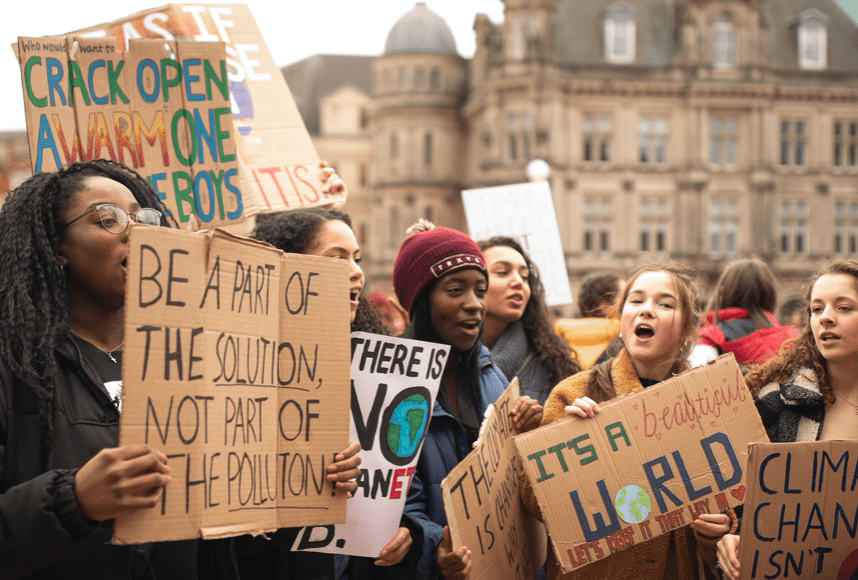 Young people protesting; image by Callum Shaw, via Unsplash.com.