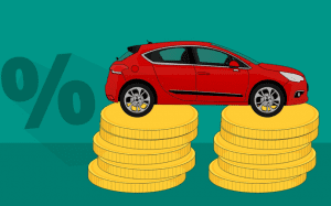 Graphic depicting the percent sign next to a red car that is resting on two stacks of gold coins; image by Mohamed Hassan, via Pixabay.com.