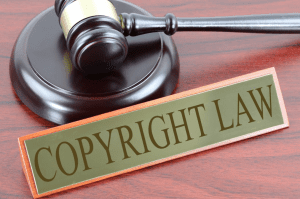 Copyright Law sign next to gavel; image by Nick Youngson, CC BY-SA 3.0, no changes, Alpha Stock Images.