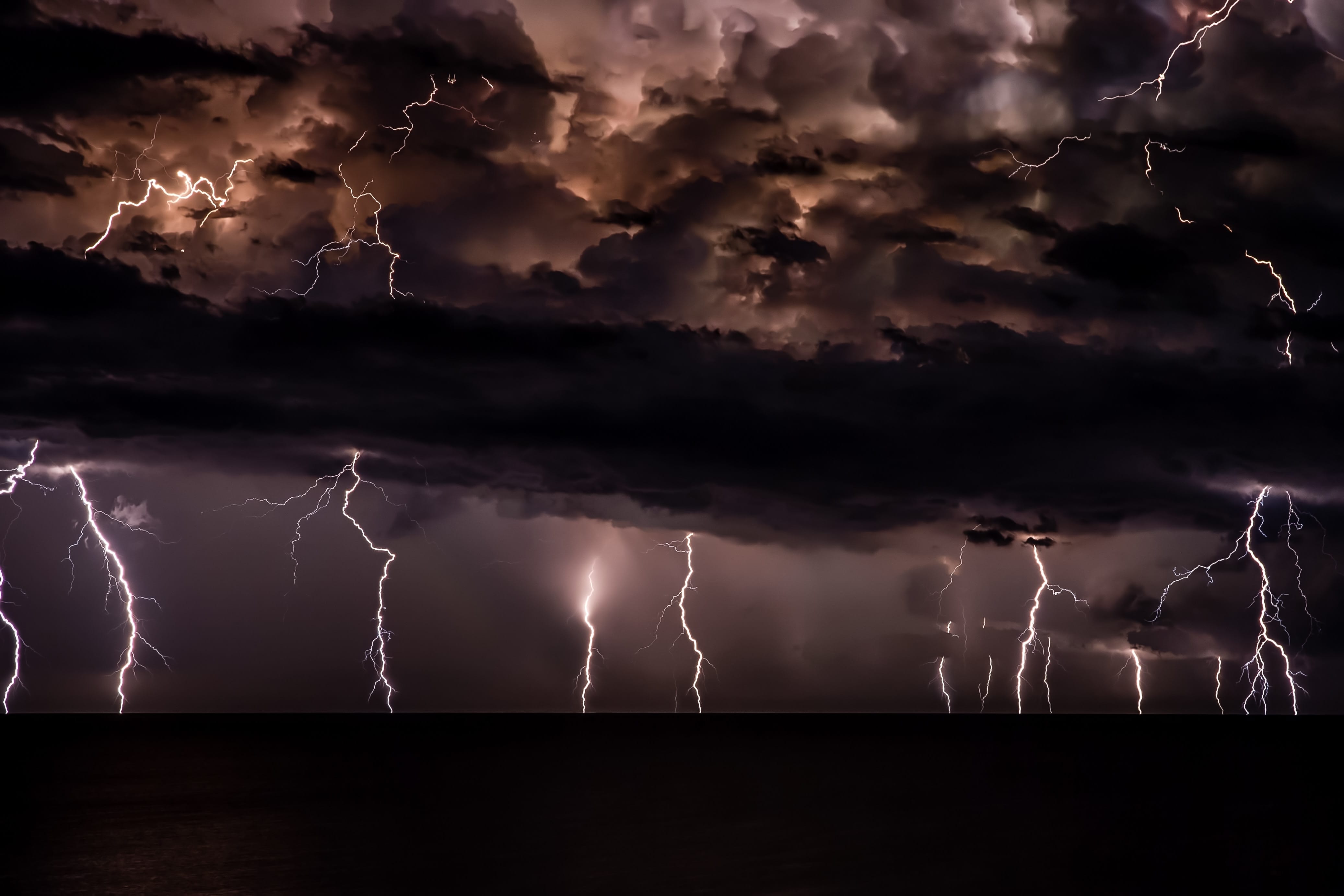 Thunderstorm with dark clouds; image by Josep Castells, via Unsplash.com.