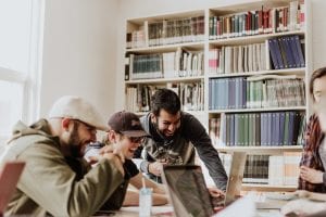 Employees celebrating a success; image by Priscilla Du Preez, via Unsplash.com.