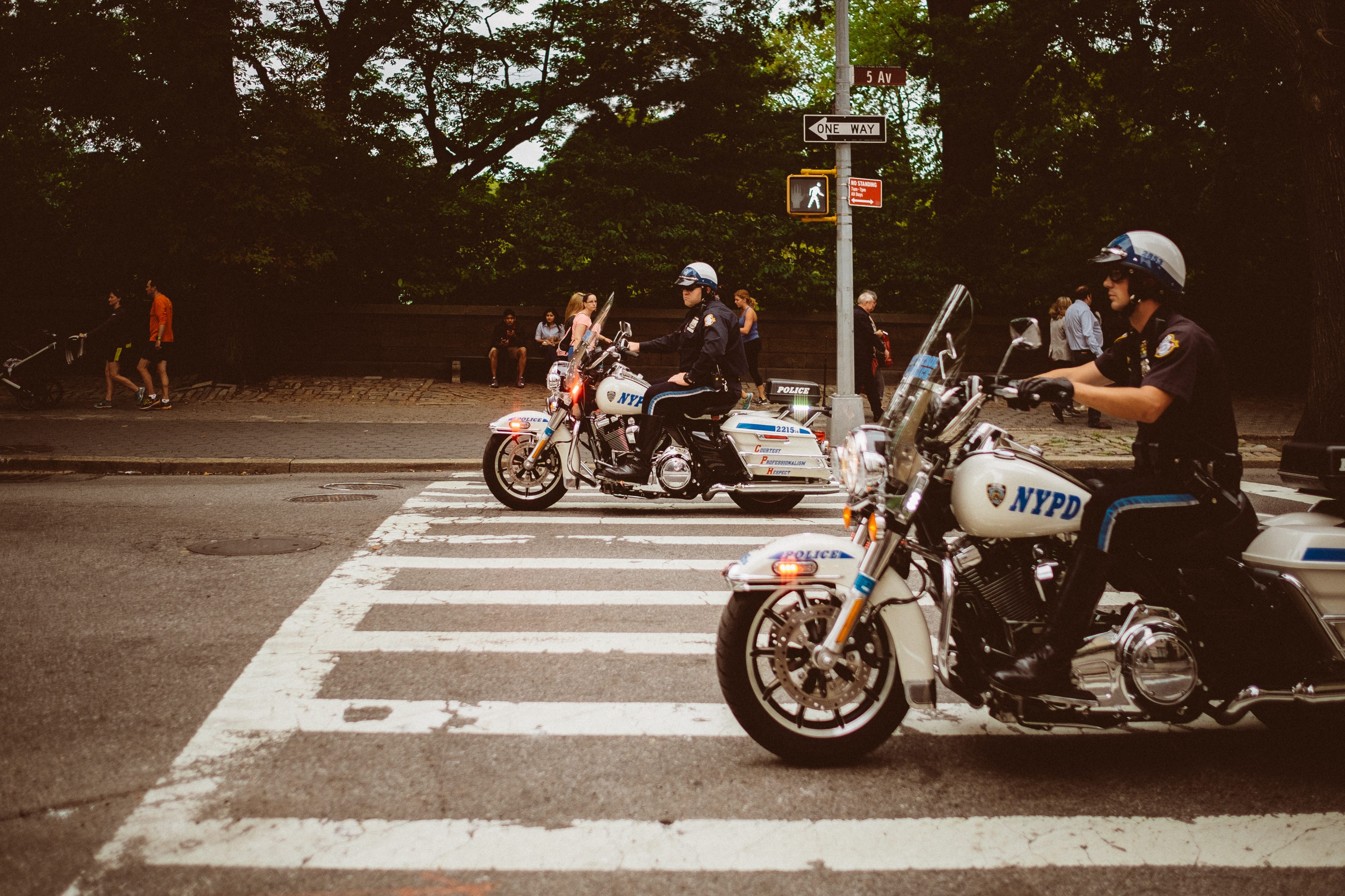 Central Park police officers on motorcycles; image by Tobias Zils, via Unsplash.com.