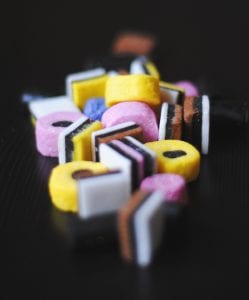 Small pile of multi-colored candy; image by Hello I’m Nik, via Unsplash.com.
