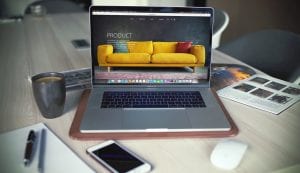 Laptop on table showing furniture product line; image by Igor Miske, via Unsplash.com.