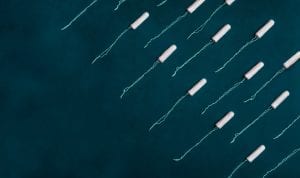 Rows of tampons on a blue background; image by Josefin, via Unsplash.com.