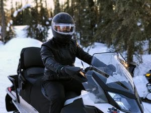 Snowmobile rider; image by Quihai Gao, via Unsplash.com.