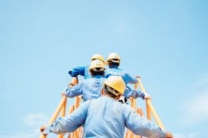 Workers on a ladder; image by Sol, via Unsplash.com.