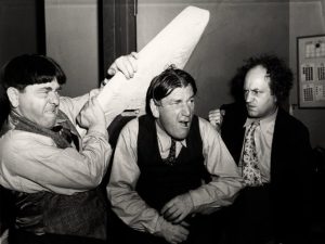 Black and white image of the Three Stooges goofing off in 1947.