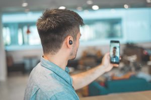 Man having video call on smartphone; image by Harry Cunningham, via Unsplash.com.