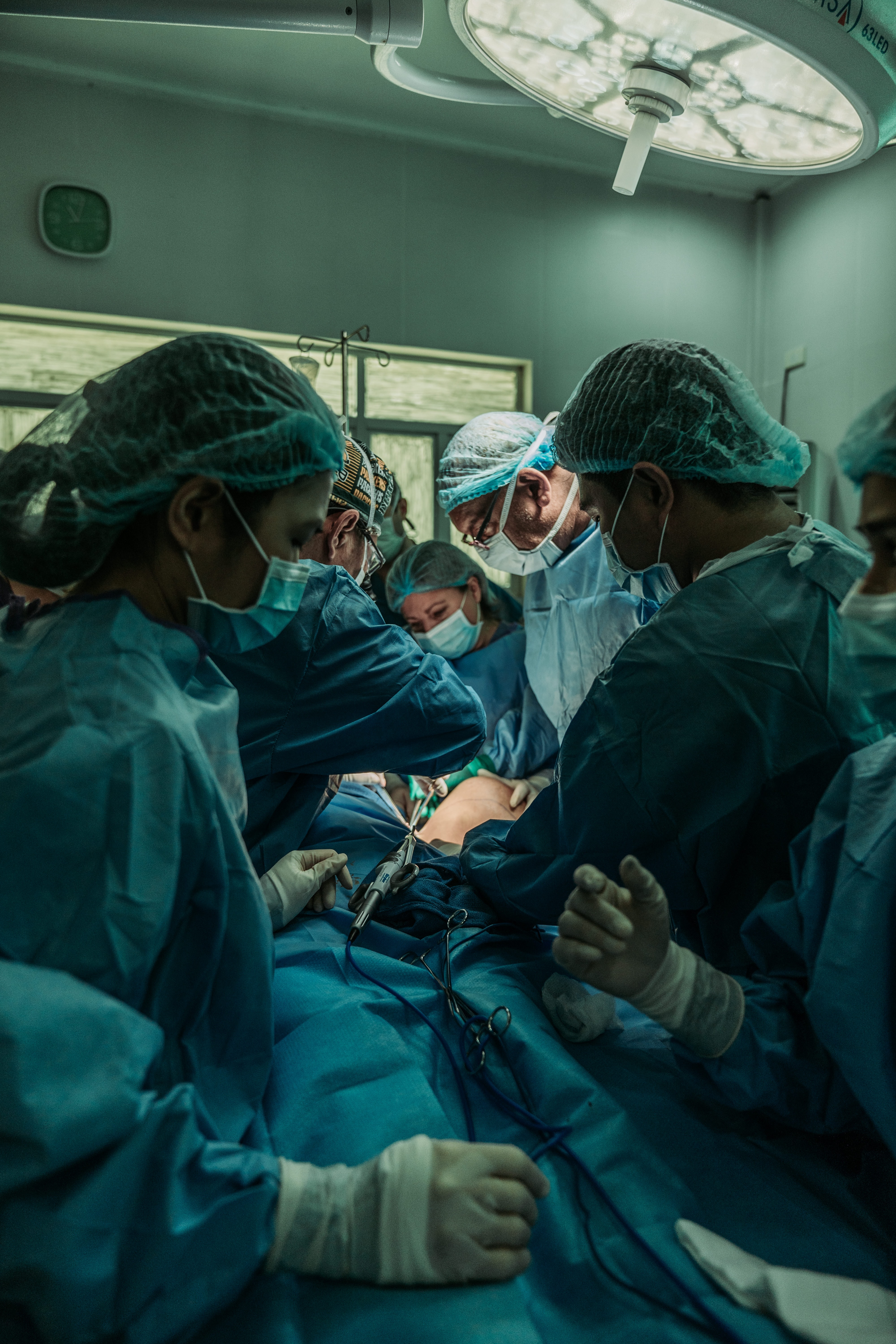 Doctor performing operation; image by JC Gellidon, via Unsplash.com.