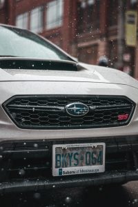 Silver car and license plate; image by Juan Rojas, via Unsplash.com.