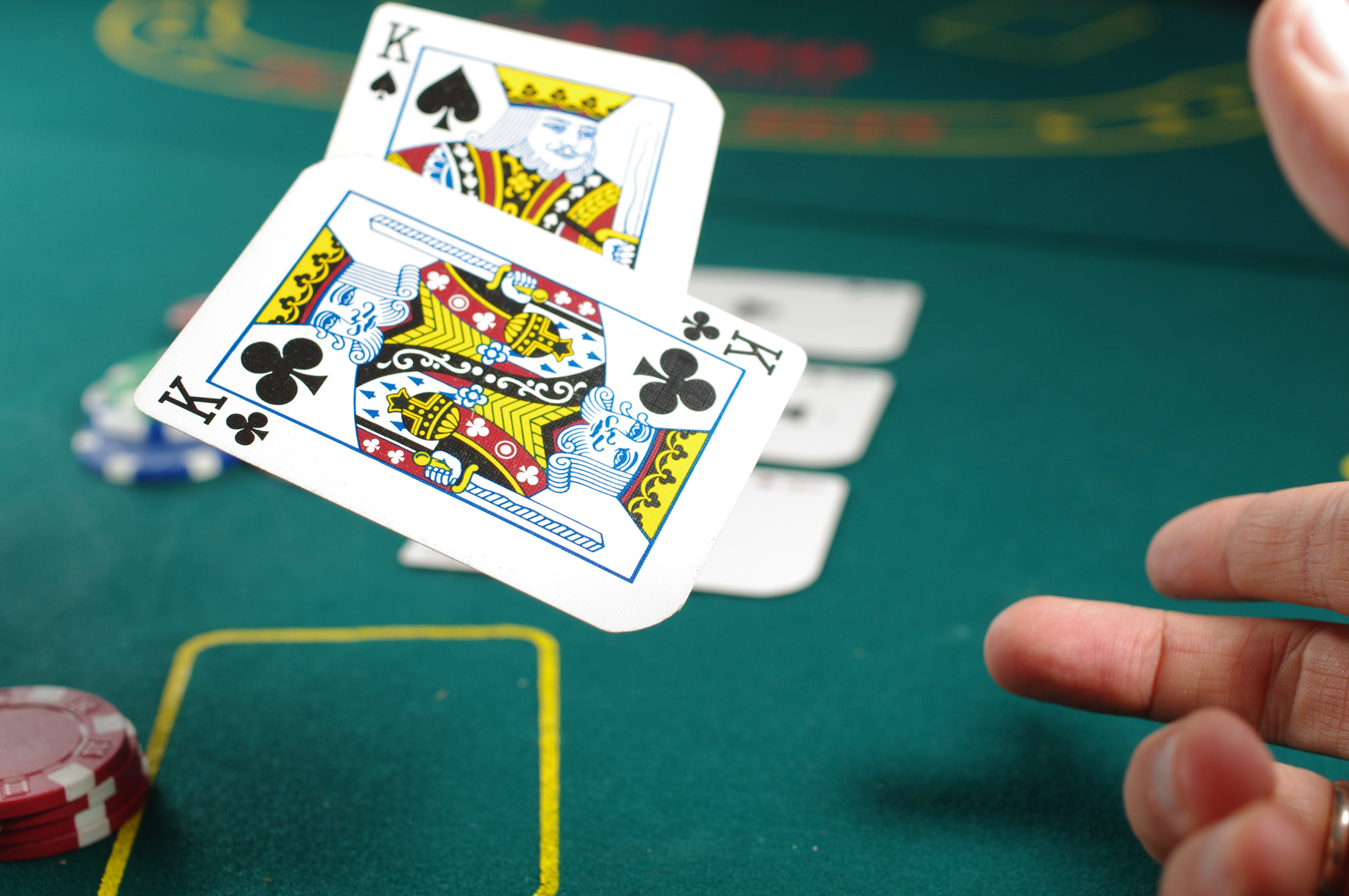 Pair of kings in a poker game; image by Michał Parzuchowski, via Unsplash.com.