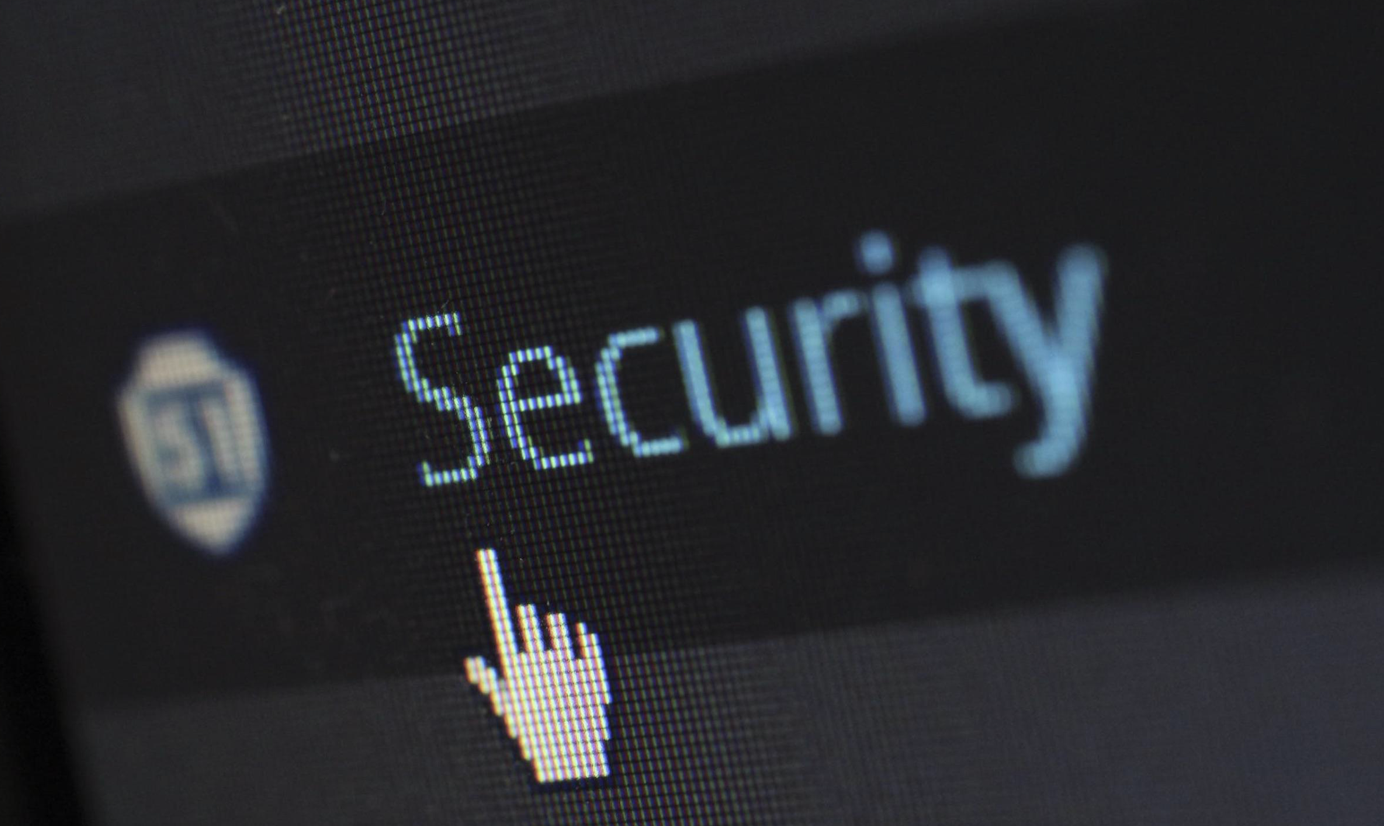 Upclose shot of computer screen with the word “Security” and a hand-shaped cursor; image by Pixabay, via Pexels.com.