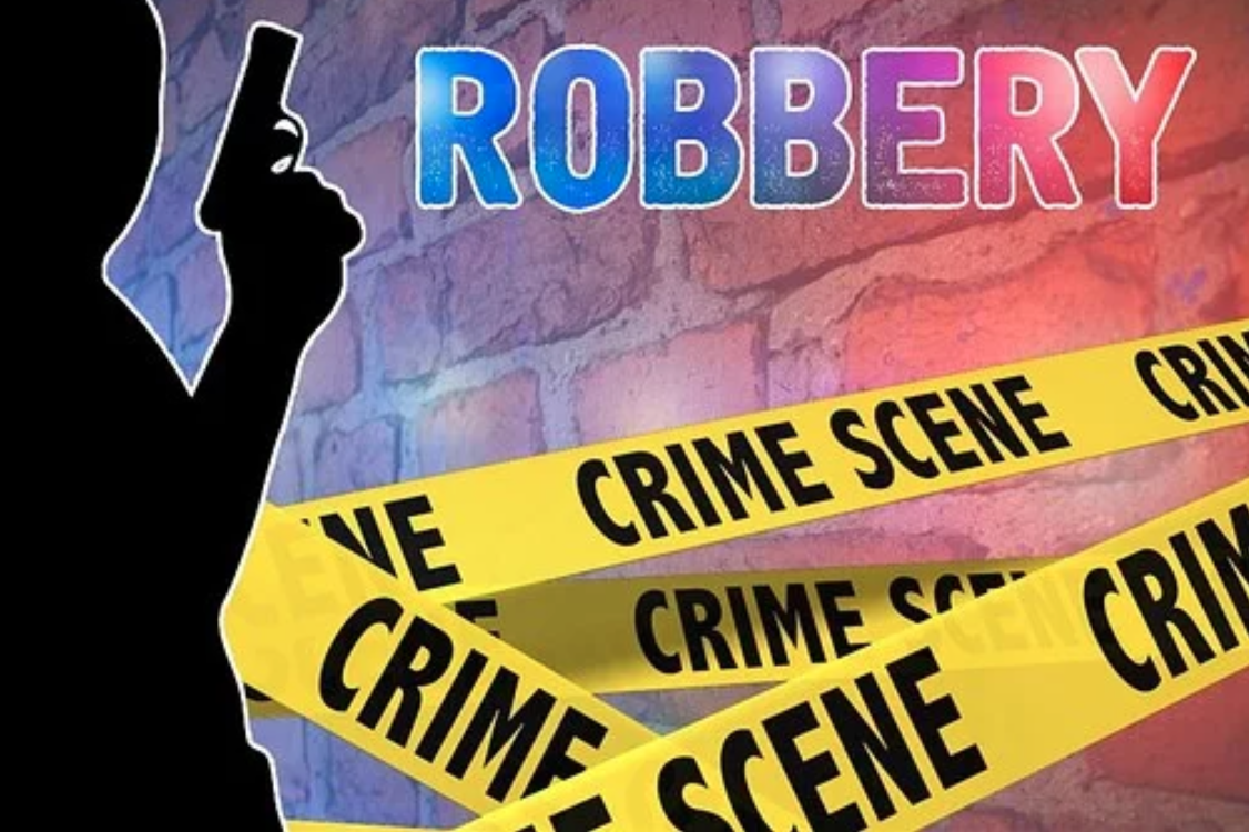 Graphic of man with gun, crime scene tape, and the word “Robbery” against a brick wall; graphic by 1800420Laws, via Pixabay.com.