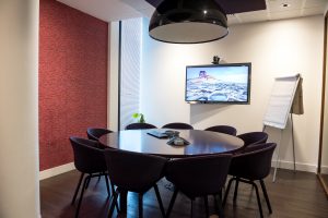 Conference room with video conferencing set up; image by Arlington Research, via Unsplash.com.