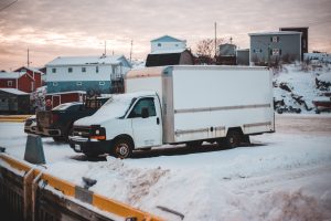 White box truck in a parking lot; image by Erik Mclean, via Unsplash.com.