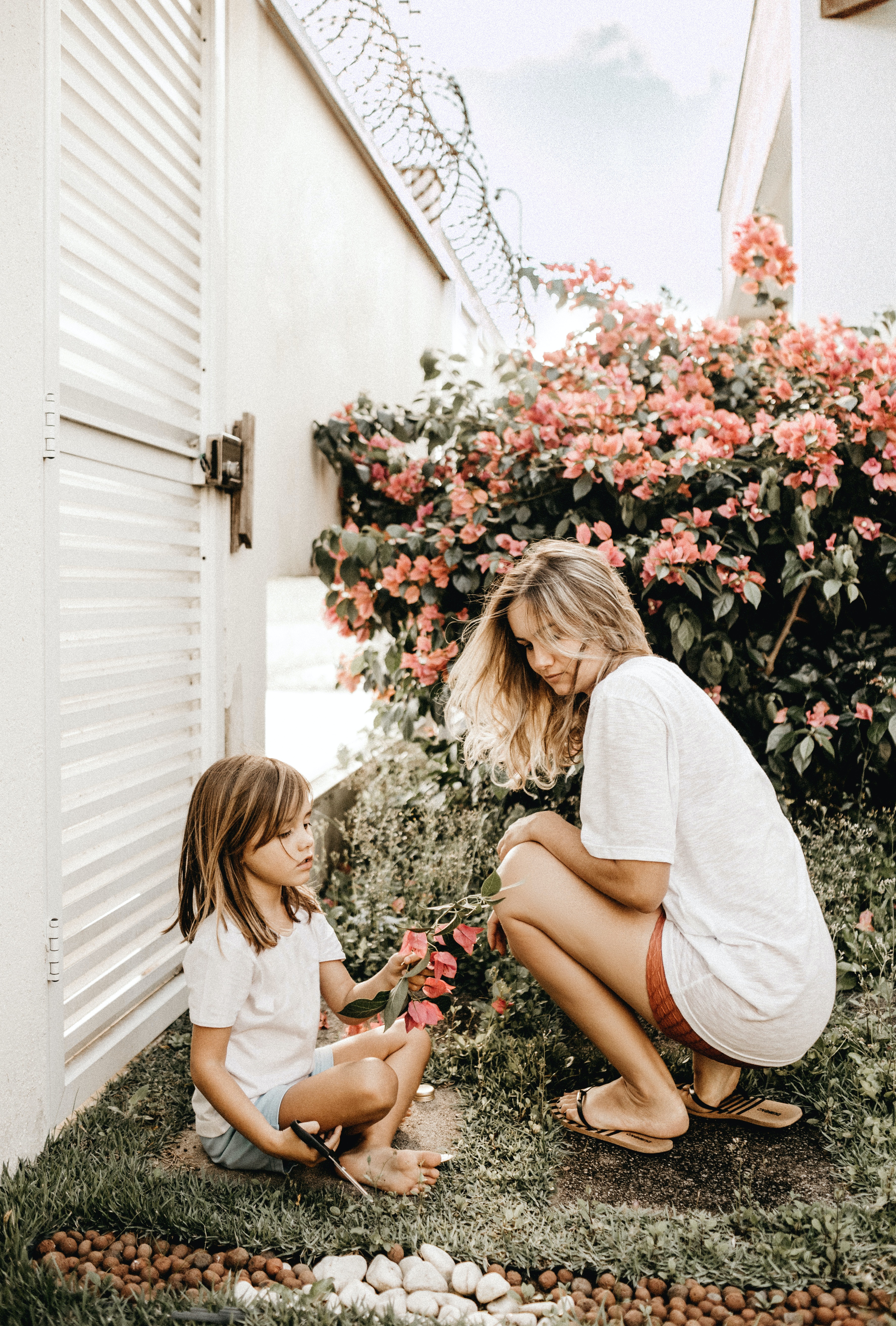 Mother and daughter in garden; image by Jonathan Borba, via Pexels.com.