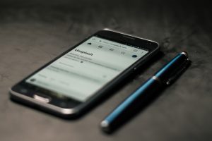 Smartphone with stylus; image be Steve Johnson, via Unsplash.com.