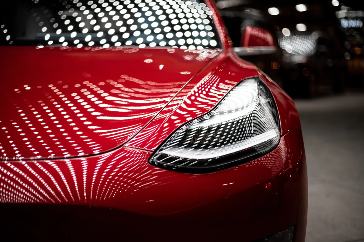 Tesla Model 3 Headlights in Dever; image by Vlad Tchompalov, via Unsplash.com.