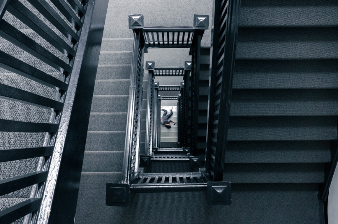 Person at bottom of stairs; image by Free-Photos, via Pixabay.com.