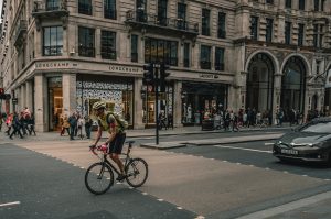 Cyclist and motorist on the road; image by Karl Bewick, via Unsplash.com.