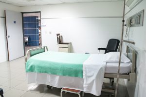 Hospital bed in room; image by Martha Dominguez de Gouveia, via Unsplash.com.