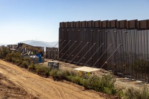 A construction crew working on the border wall.