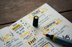 Yellow highlighter on journal; image by Estée Janssens, via Unsplash.com.