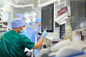 Medical staff checking patient’s stats on monitor; image by Javier Matheu, via Unsplash.com.