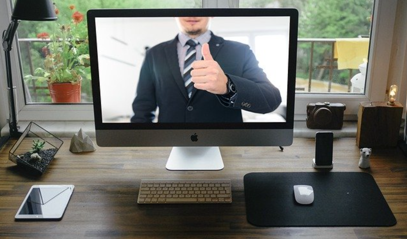 Online meeting, man in suit giving thumbs up gesture; image by Tumisu, via Pixabay.com.