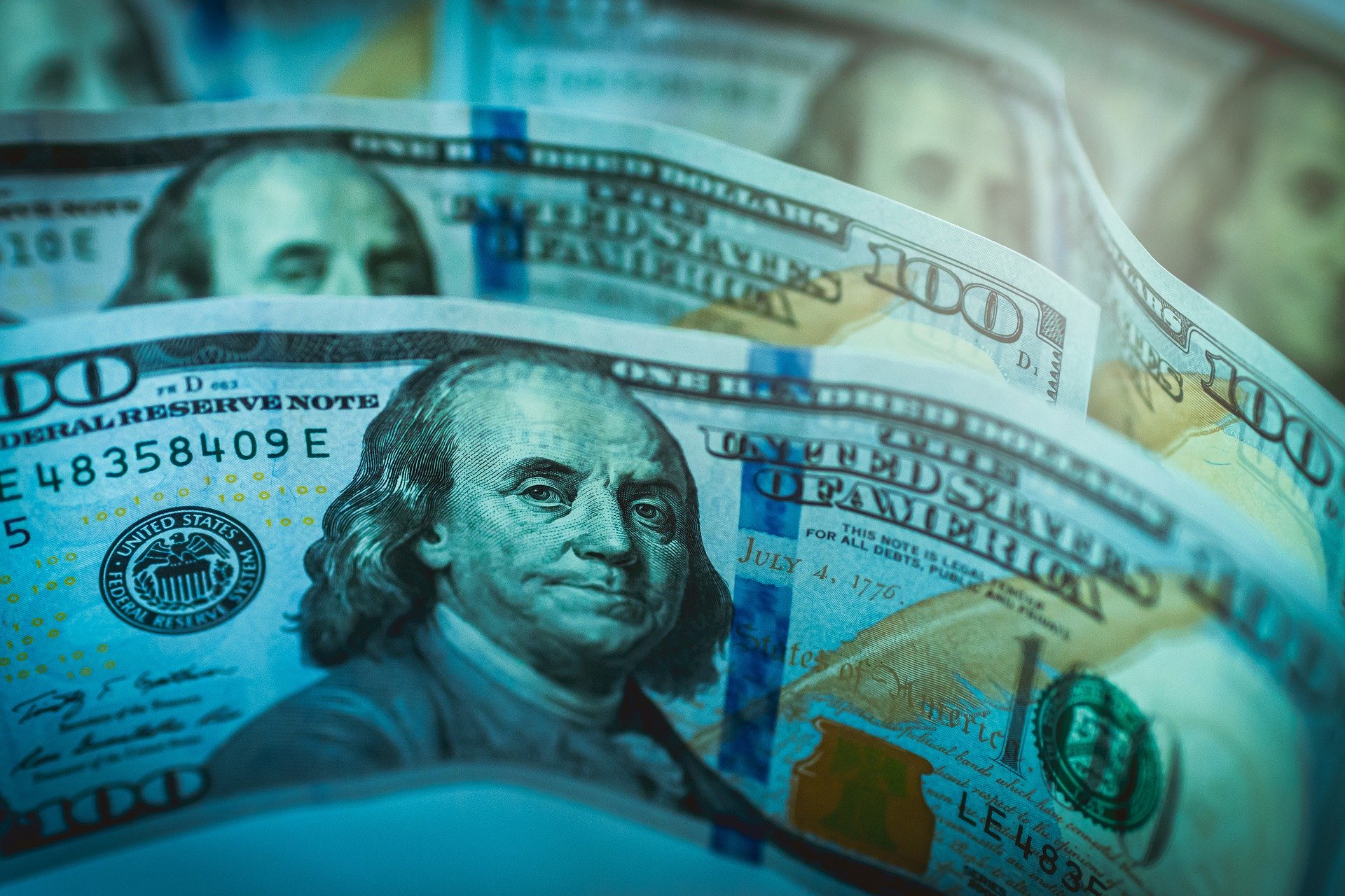 Close-up of $100 bills; image by Jeshoots, via Pixabay.com.