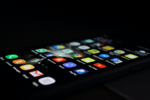 Smartphone with apps showing on screen; image by Rami Al-zayat, via Unsplash.com.