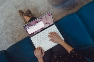 Woman working on laptop; image by XPS, via Unsplash.com.