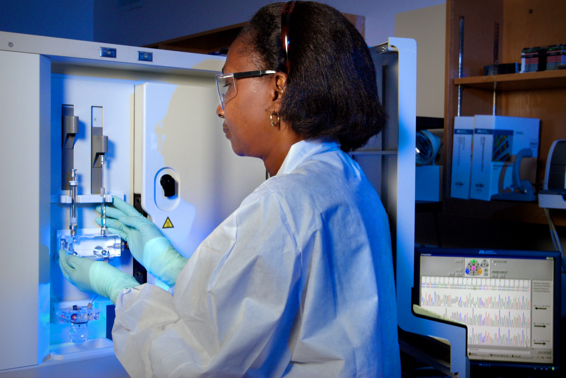 This 2007 photograph depicts CDC Guest Researcher, Dr. Karidia Diallo, preparing the ABI DNA Analyzer. Image by CDC/Hsi Liu, Ph.D., MBA; James Gathany, Public Domain.