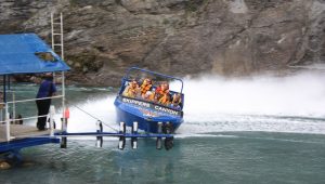 Shallow river high speed boating at Skippers canyon near Queenstown, New Zealand; image by Shahid Kazi, via Unsplash.com.