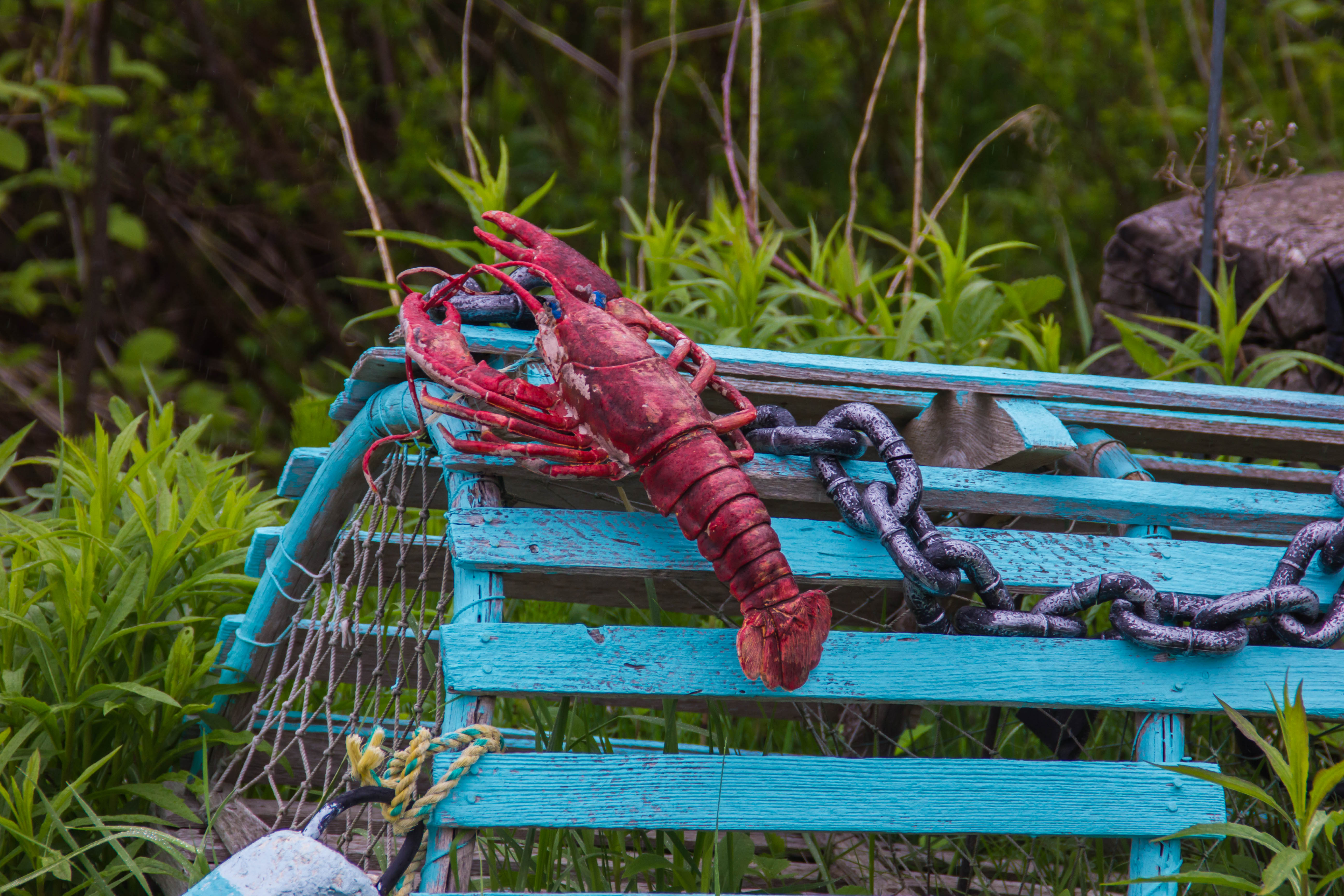 A blue, wooden lobster trap in Nova Scotia, Canada.